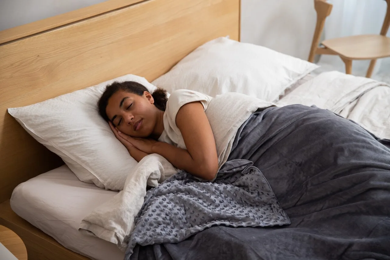 Woman peacefully sleeping in bed calming bedtime routine