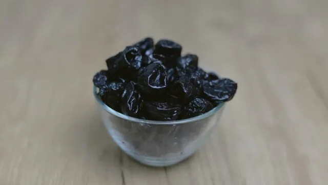 Bowl of prunes for constipation relief natural remedy