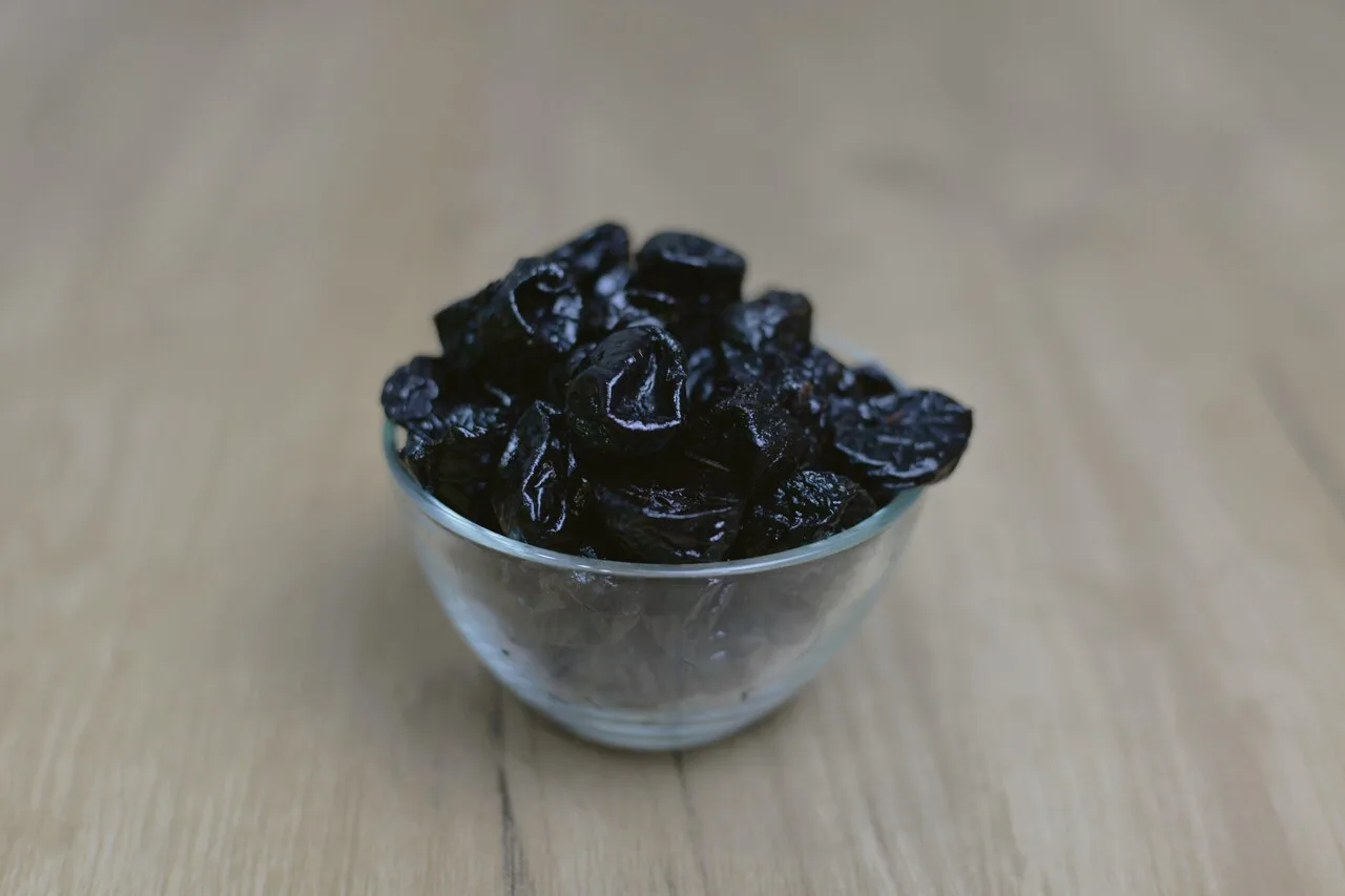 Bowl of prunes for constipation relief natural remedy