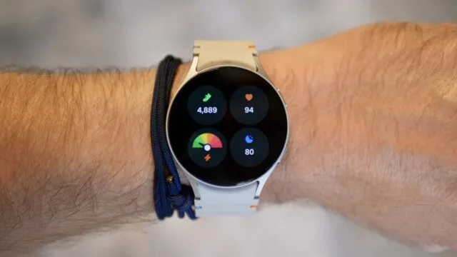 Smartwatch displaying fitness tracker metrics including steps heart rate and sleep score
