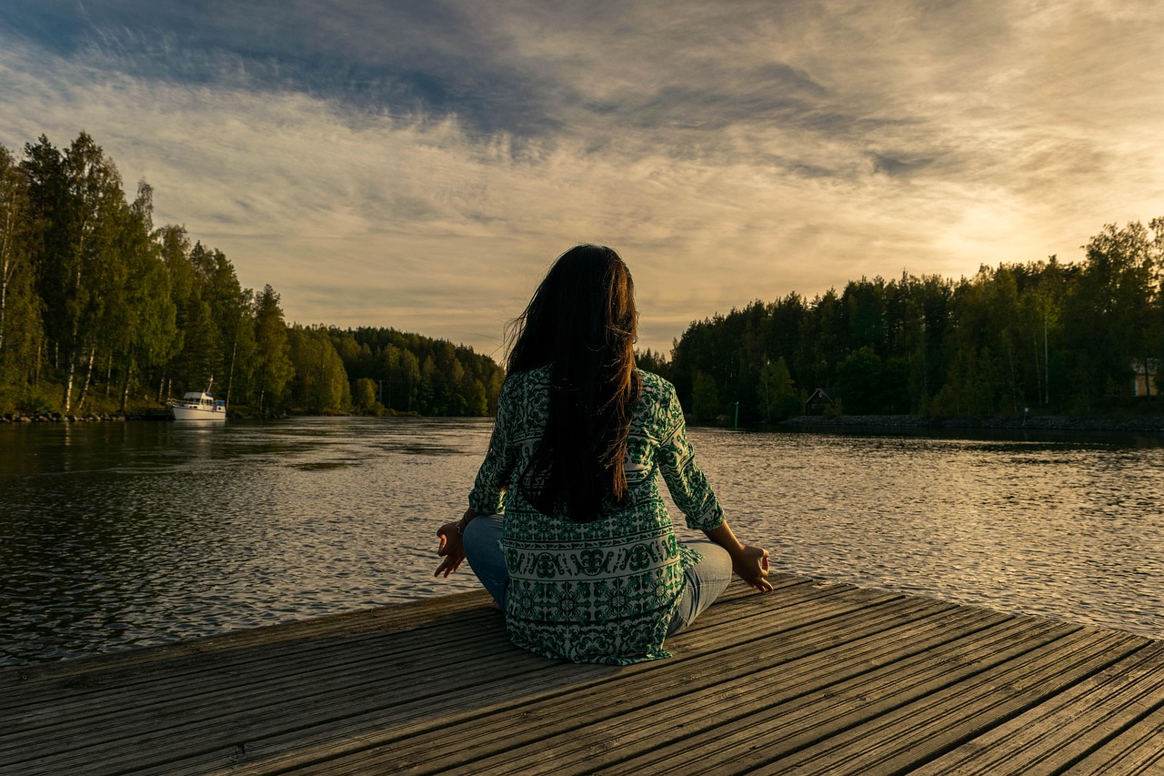 Person practicing mindful breathing to calm an overactive mind