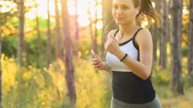 Female athlete running outdoors representing the growth of women's sports
