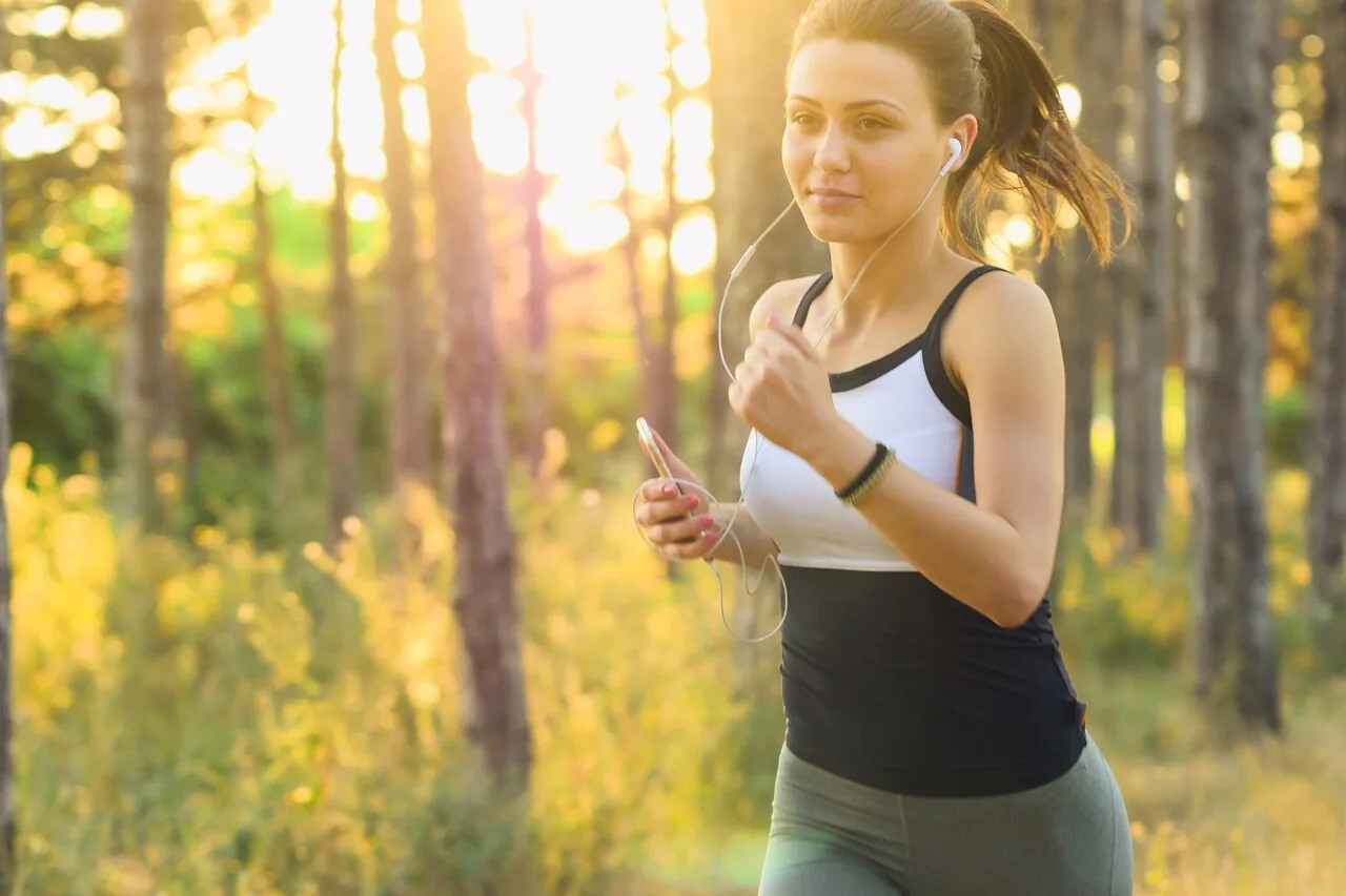Female athlete running outdoors representing the growth of women's sports