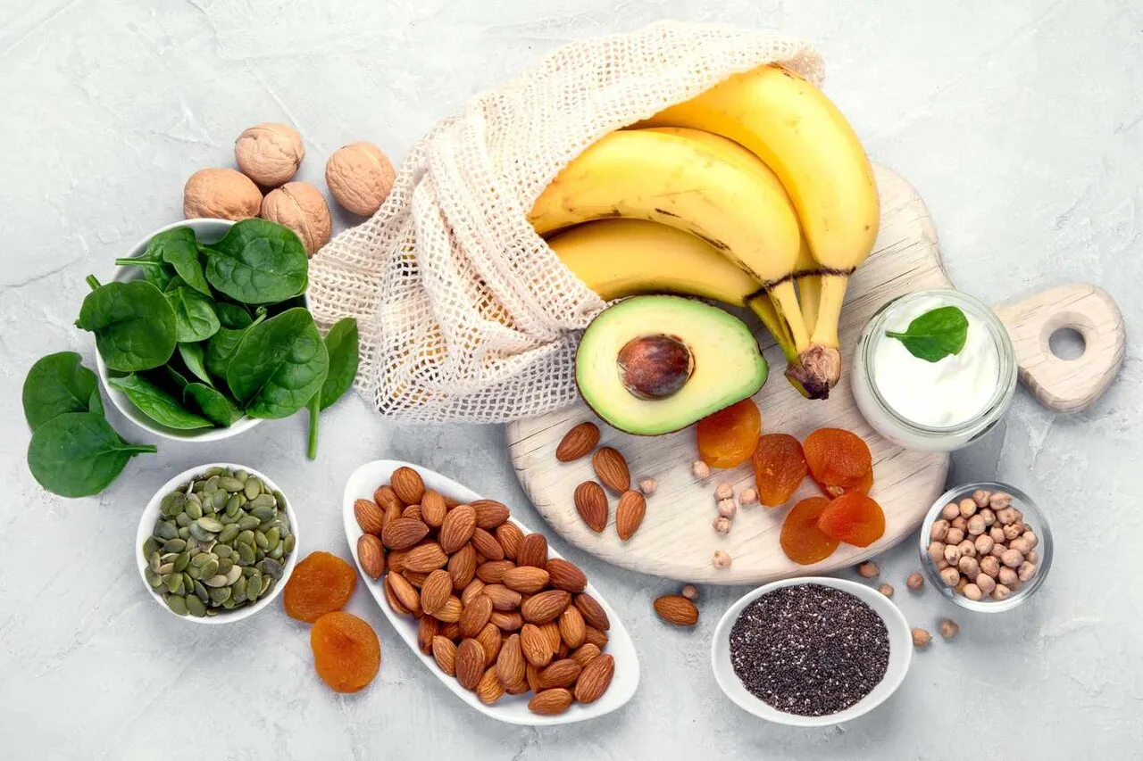 Potassium-rich foods including bananas, avocado, spinach, almonds and seeds arranged to illustrate how to balance sodium and potassium intake
